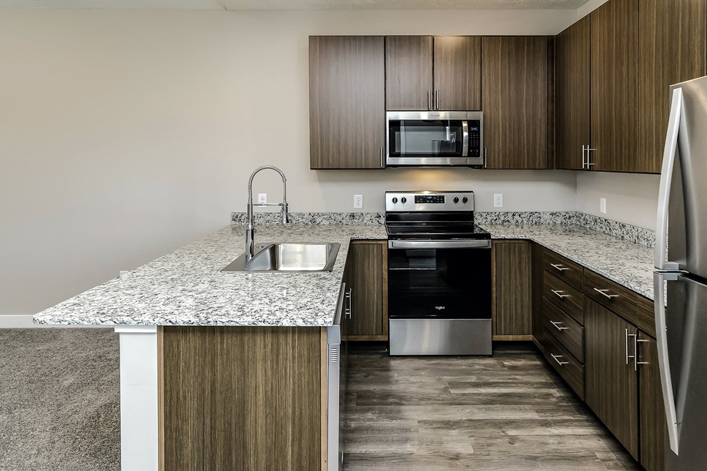 Studio, 1, 2 and villa-style homes featuring stainless steel appliances, granite coutertops, plank flooring, and many other amazing amenities at The 8801 in Lincoln, NE.