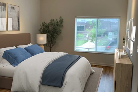 A bedroom with a bed, nightstand, and window.