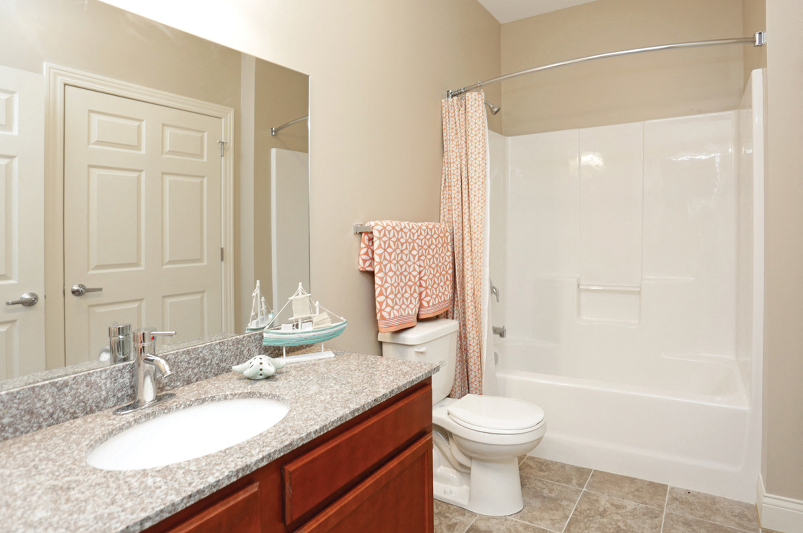 a bathroom with a sink and a toilet and a shower