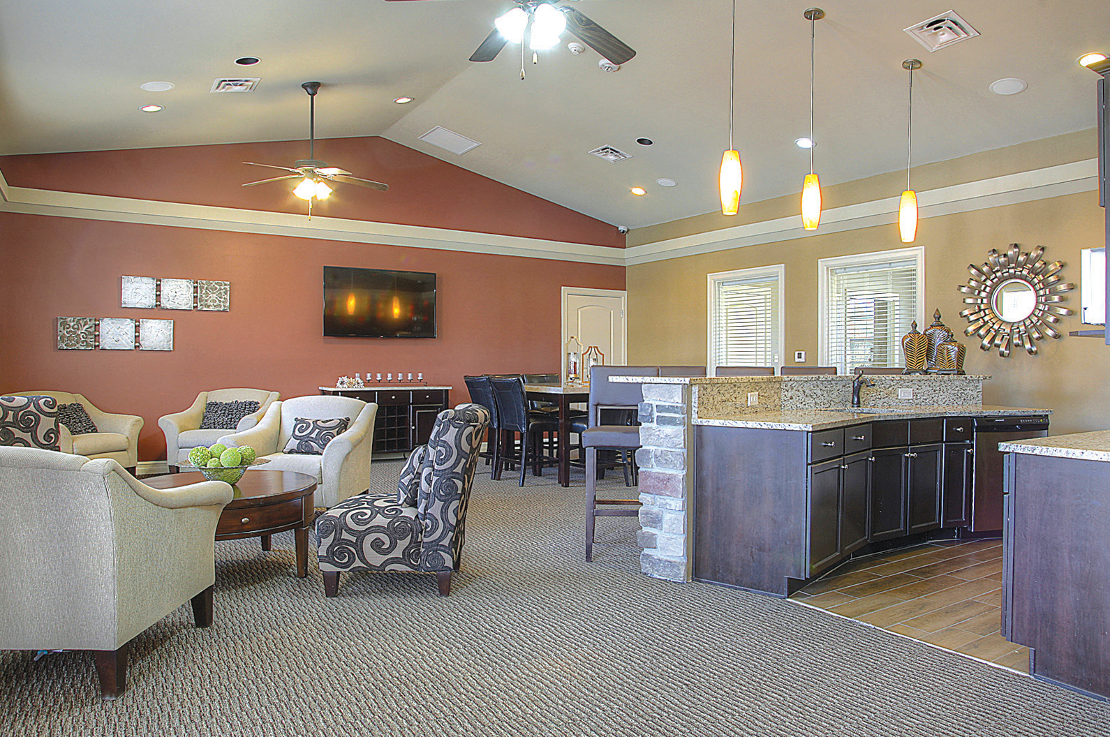 a living room with a kitchen and a dining room