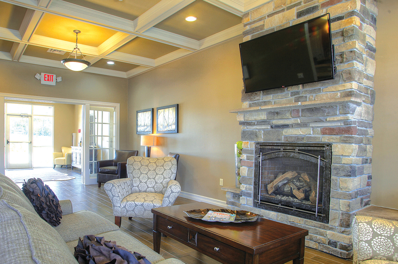a living room with a fireplace and a television