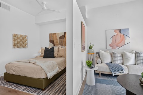 A bedroom with a bed and a couch.
