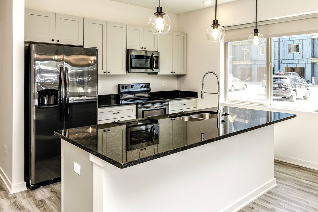 Large stylish kitchens with stainless steel appliances at Edge 204 Apartments in Omaha, NE