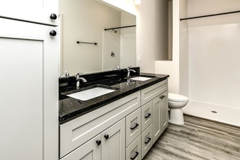 Large bathrooms with granite countertops at Edge 204 Apartments in Omaha, NE - Photo Gallery 5