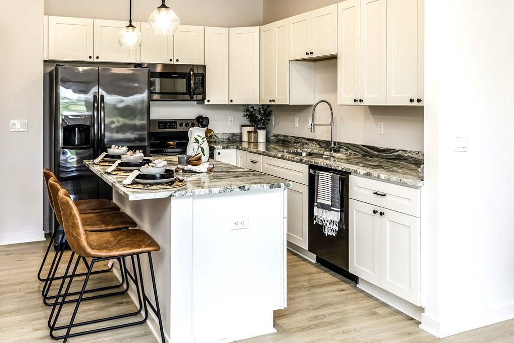Large stylish kitchens with stainless steel appliances at Edge 204 Apartments in Omaha, NE