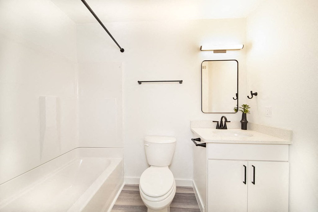 Remodeled apartment homes featuring premium appliances, custom cabinetry, lighting, and LTV flooring at Greenway Flats in Fayetteville, AR.