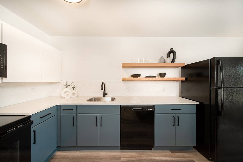 Remodeled apartment homes featuring premium appliances, custom cabinetry, lighting, and LTV flooring at Greenway Flats in Fayetteville, AR.