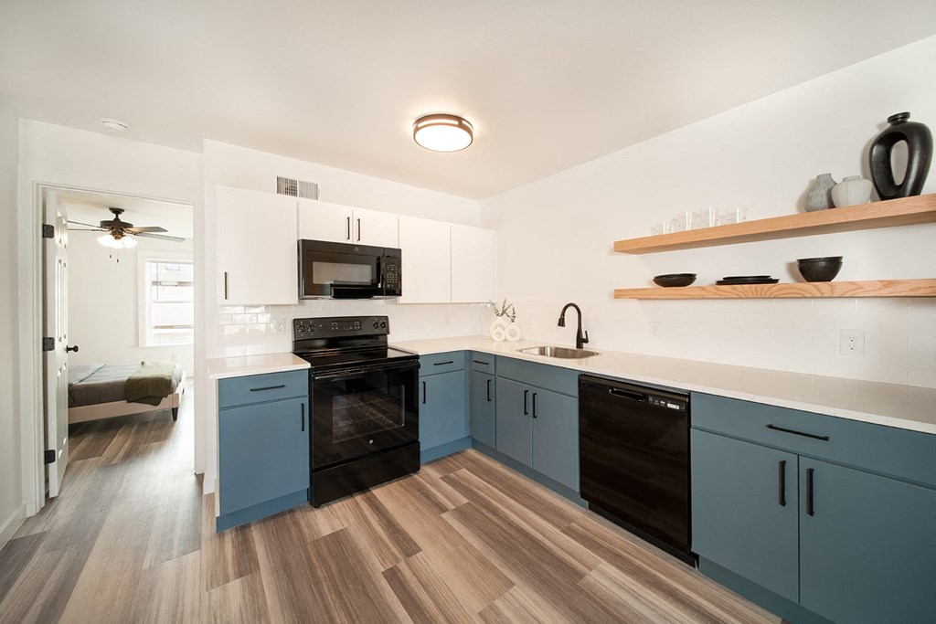 Remodeled apartment homes featuring premium appliances, custom cabinetry, lighting, and LTV flooring at Greenway Flats in Fayetteville, AR.