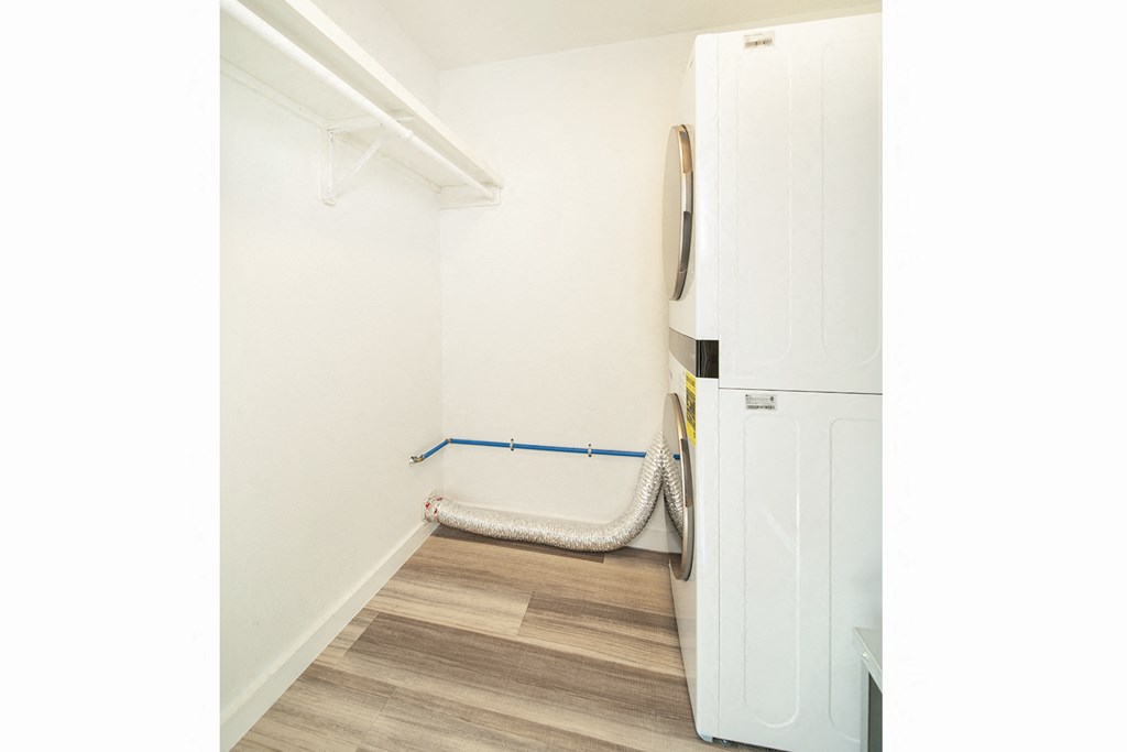 Remodeled apartment homes featuring premium appliances, custom cabinetry, lighting, and LTV flooring at Greenway Flats in Fayetteville, AR.