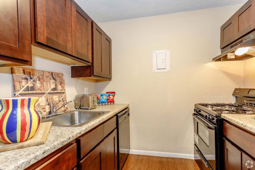 Model unit with dark cabinets at Hudson Pointe Apartments in Kansas City, MO - Photo Gallery