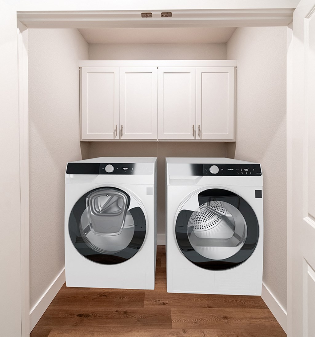 Two and three-bedroom townhomes featuring premium appliances, LVT flooring, garages, custom countertops, custom cabinetry and more at Hawthorne Grove in Rogers, AR