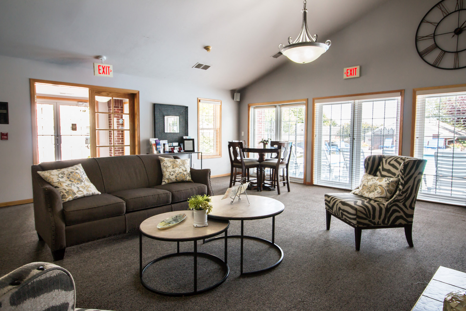 a living room with couches and chairs and a table