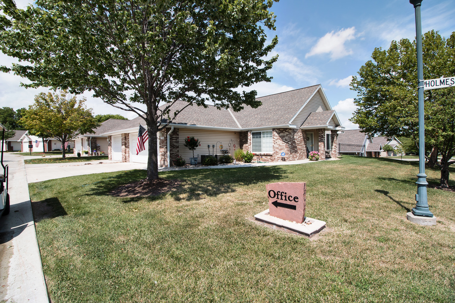 a house with an office sign in front of it