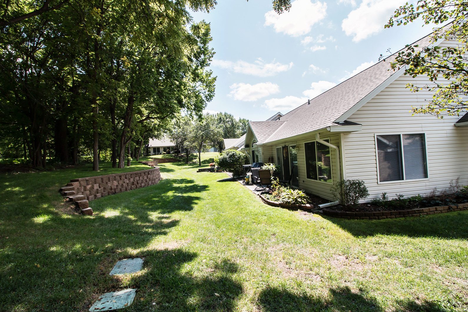 a yard in front of a white house