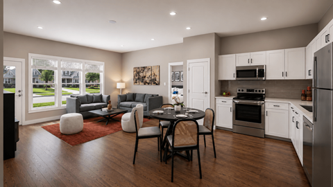 A modern kitchen with a dining table set for four.