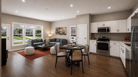 A modern kitchen with a dining table set for four.