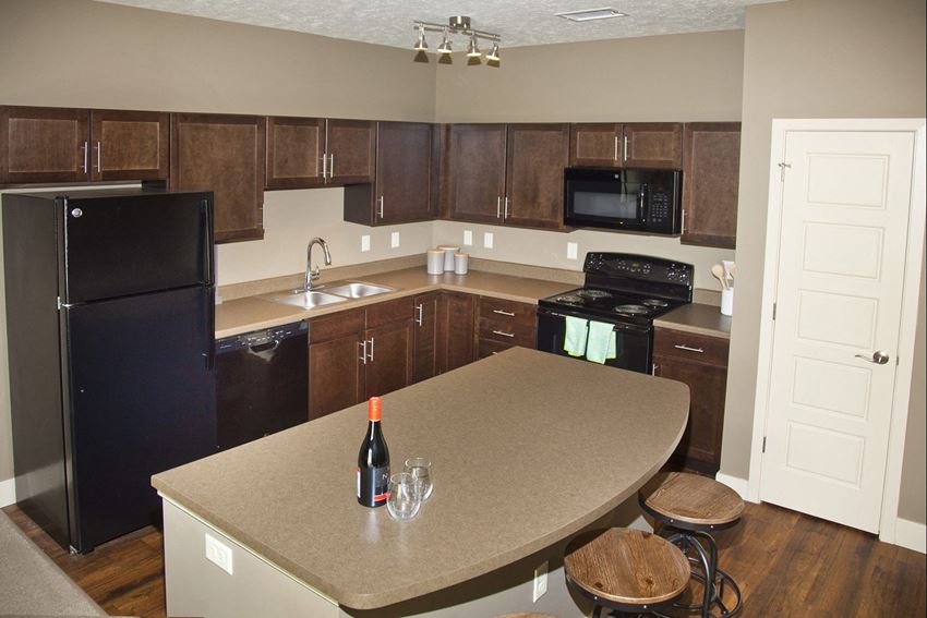 Large kitchen with extra storage and dark cabinets at The Sterling Kearney in Kearney, NE