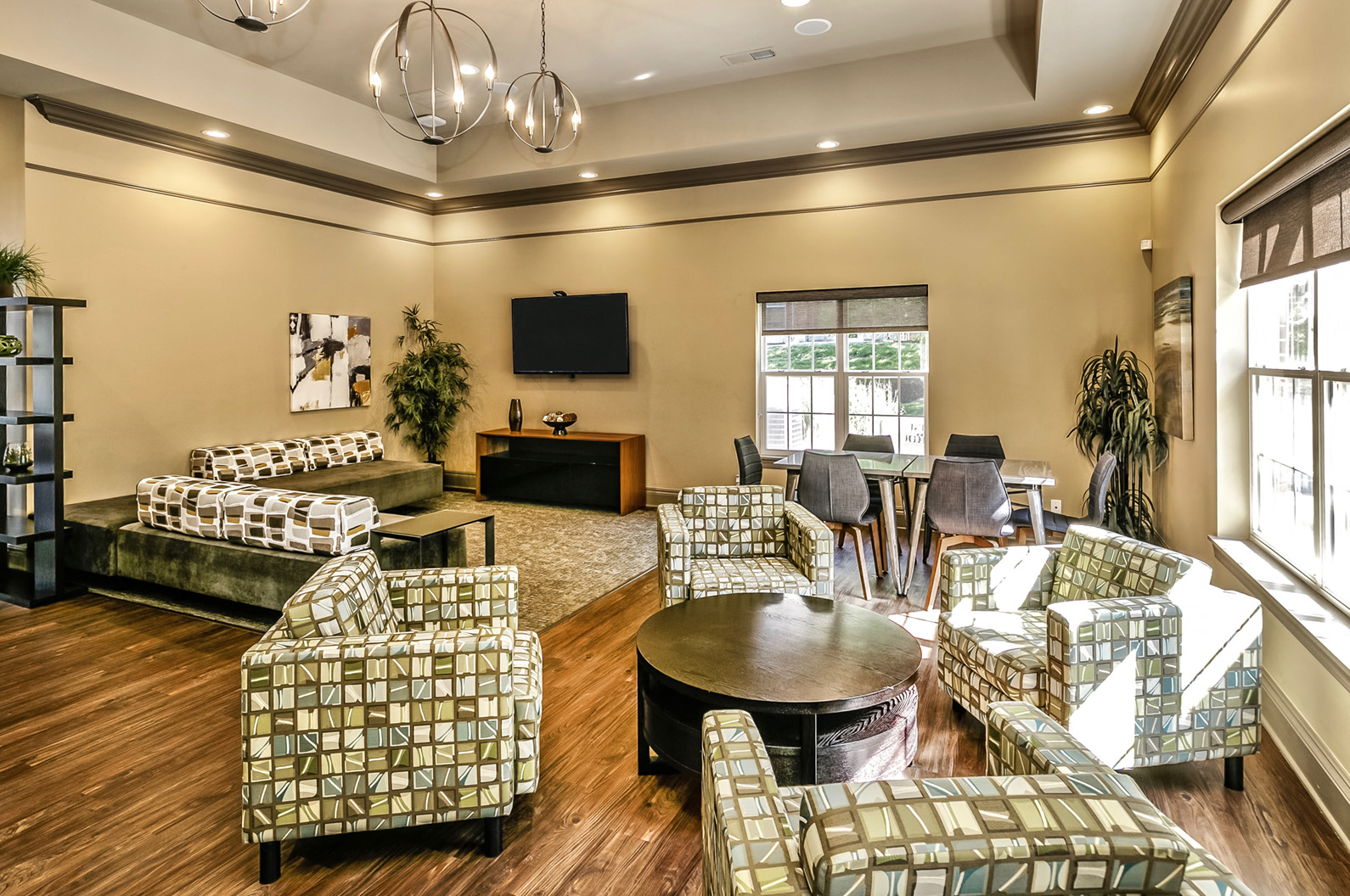 a living room with couches and chairs and a table