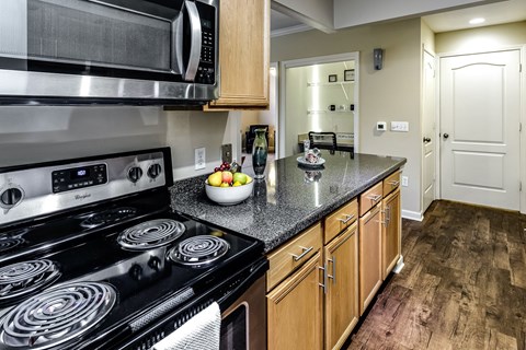 a kitchen with stainless steel appliances and granite counter tops
