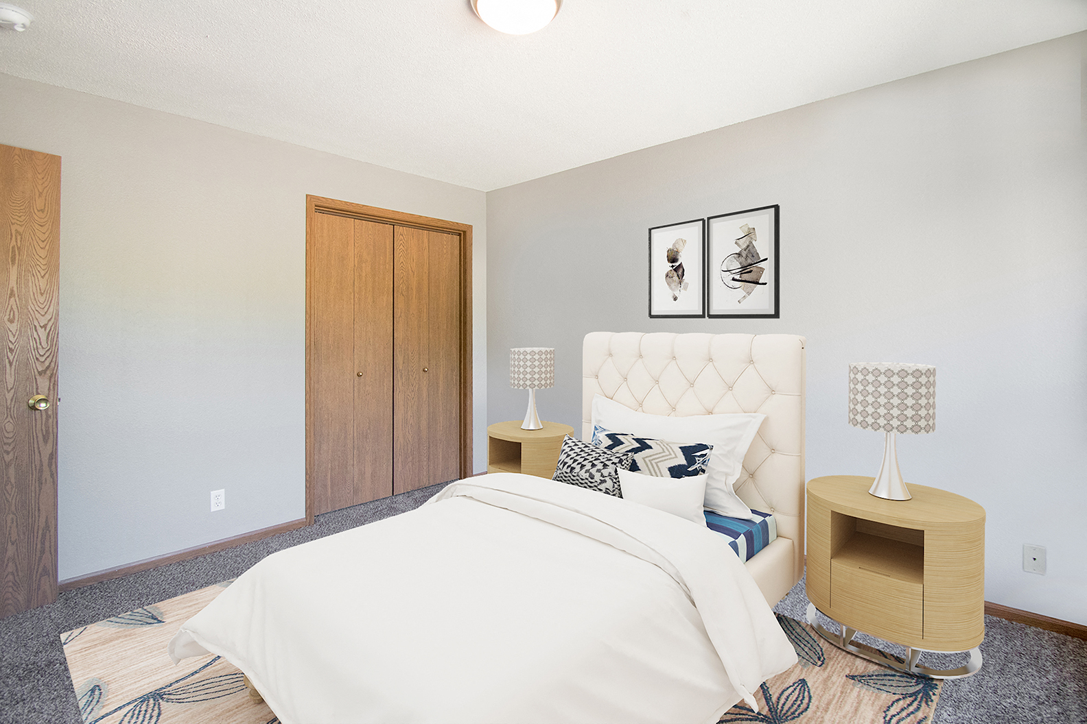 a bedroom with a white bed and a wooden closet