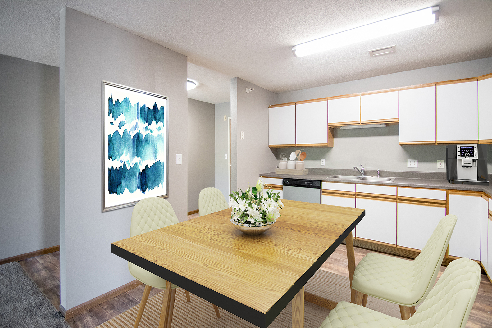 a kitchen and dining room with a table and chairs