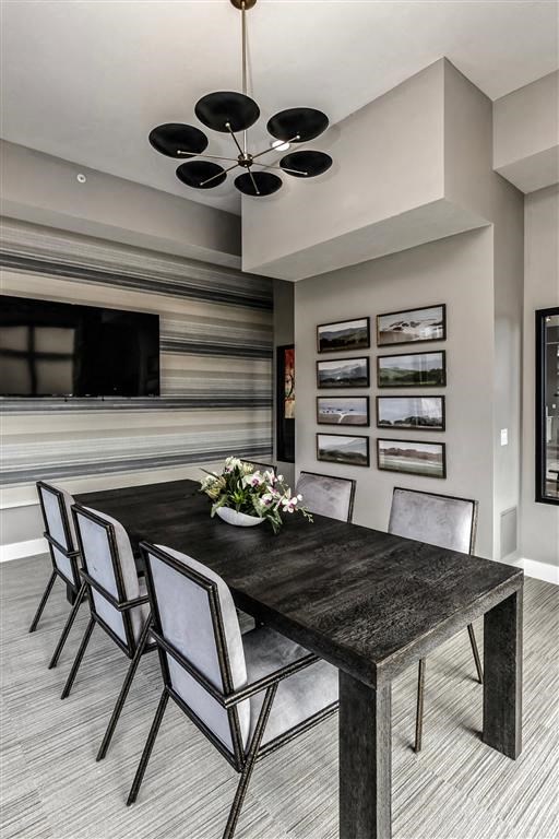 a dining room with a table and chairs