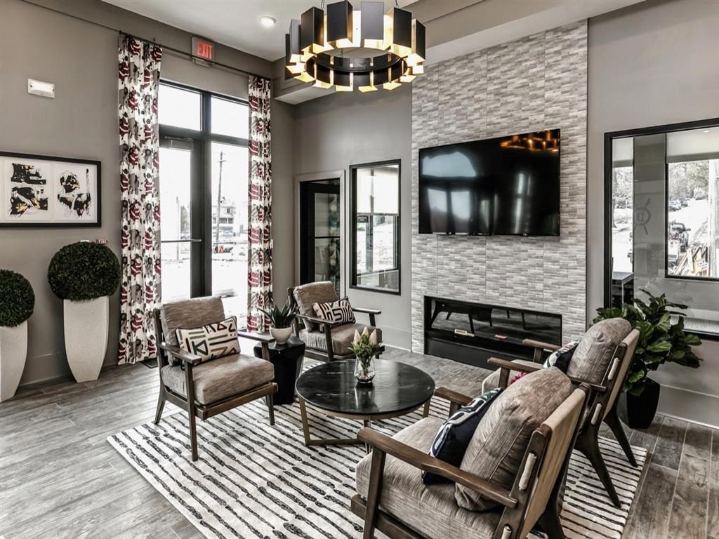 a living room with a fireplace and a television