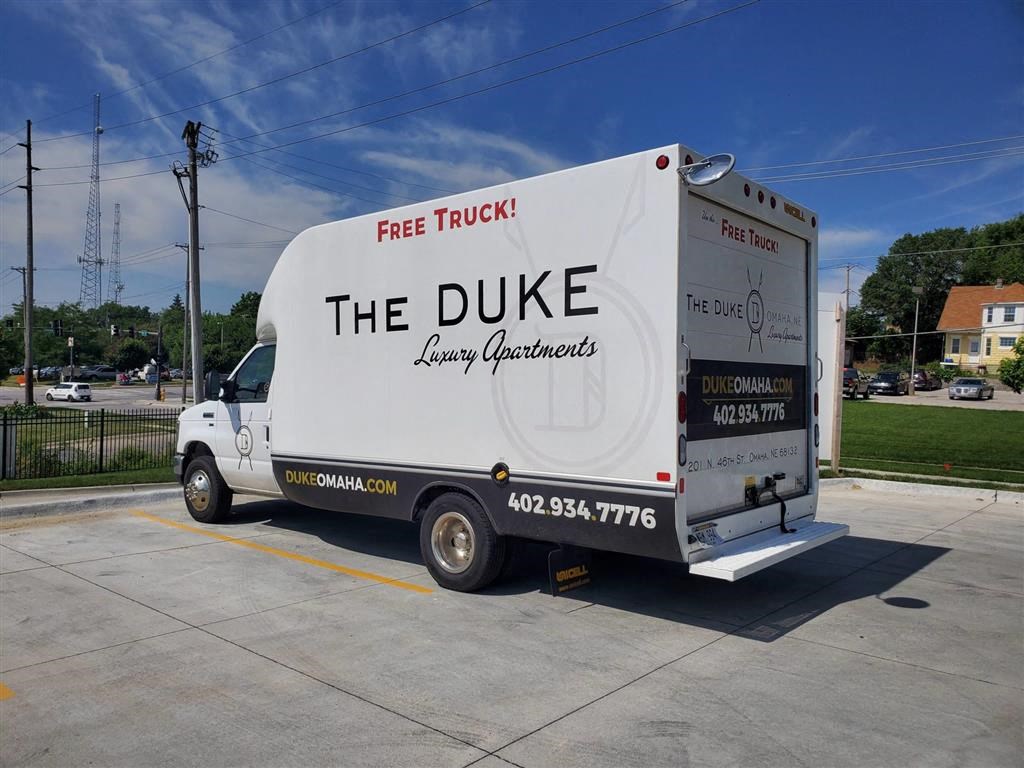 a white truck is parked in a parking lot