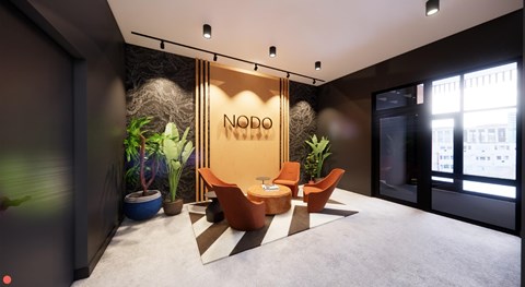 A modern office space with a NODO sign on the wall.