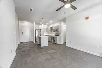 One and two Bedroom Apartment Homes with Large Kitchens with ample storage and light cabinets, quarts countertops and stainless steel appliances at Pinnacle Heights Apartments in Rogers, Arkansas - Photo Gallery 4
