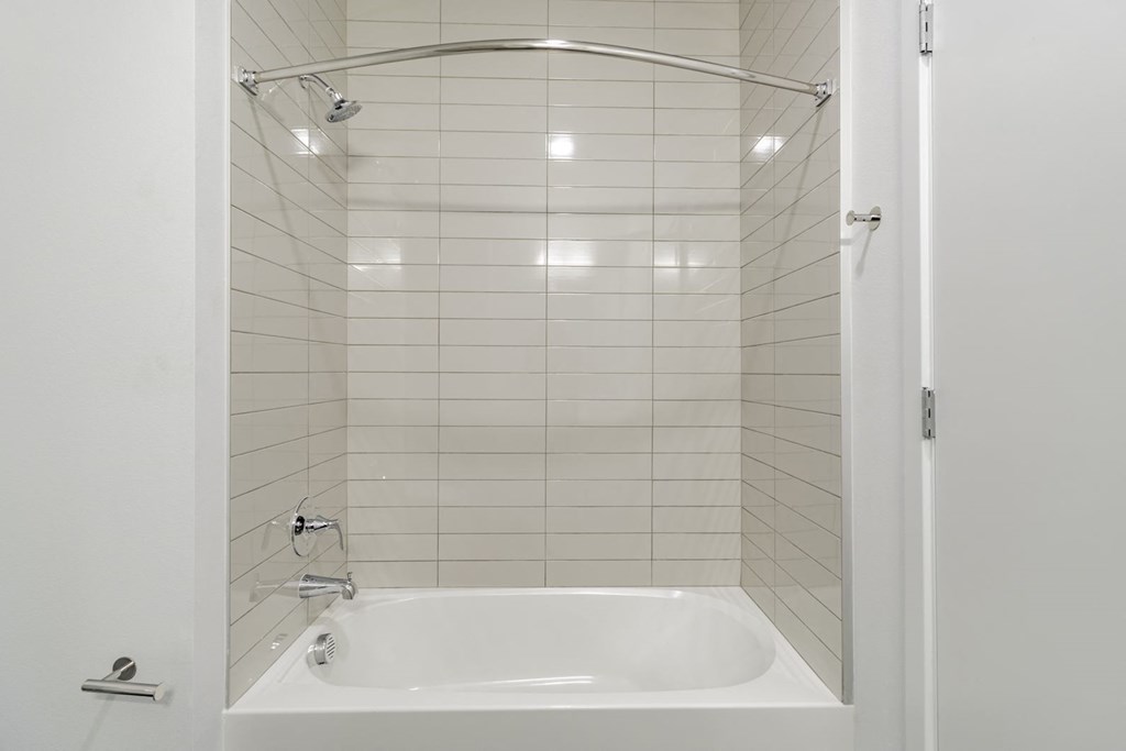 Bathrooms featuring quartz countertops extra storage and space at Pinnacle Heights Apartments at Rogers, Arkansas.