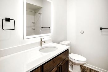 One, two and three-bedroom floor plans featuring two interior design schemes, quartz countertops, tile backsplash, stainless steel appliances, backlit mirrors, high-end finishes and more at 148 Place Apartments in Omaha, NE