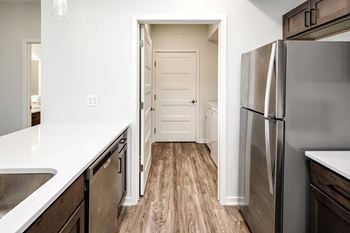 One, two and three-bedroom floor plans featuring two interior design schemes, quartz countertops, tile backsplash, stainless steel appliances, backlit mirrors, high-end finishes and more at 148 Place Apartments in Omaha, NE