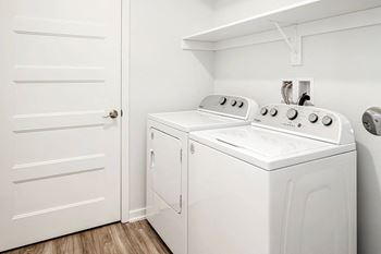 One, two and three-bedroom floor plans featuring two interior design schemes, quartz countertops, tile backsplash, stainless steel appliances, backlit mirrors, high-end finishes and more at 148 Place Apartments in Omaha, NE