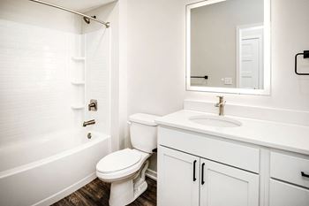 One, two and three-bedroom floor plans featuring two interior design schemes, quartz countertops, tile backsplash, stainless steel appliances, backlit mirrors, high-end finishes and more at 148 Place Apartments in Omaha, NE