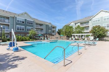 Resort-style pool with sundeck at Aventine at Wilderness Hills in Lincoln, NE