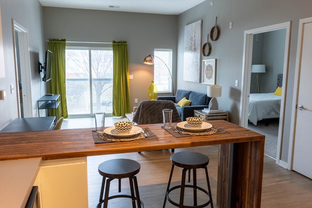 Studio, one, and two-bedroom apartment featuring stainless steel appliances, artistic industrial design, custom butcher block island, in-unit washer and dryer, and more at Benson Lights Apartments in Benson, NE