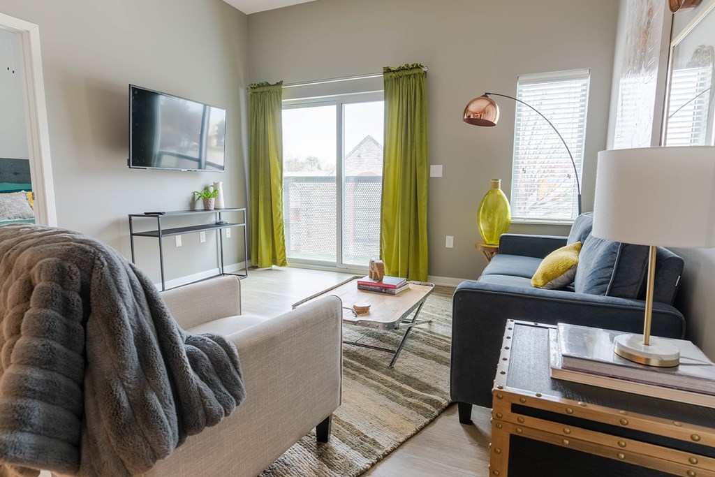 Studio, one, and two-bedroom apartment featuring stainless steel appliances, artistic industrial design, custom butcher block island, in-unit washer and dryer, and more at Benson Lights Apartments in Benson, NE