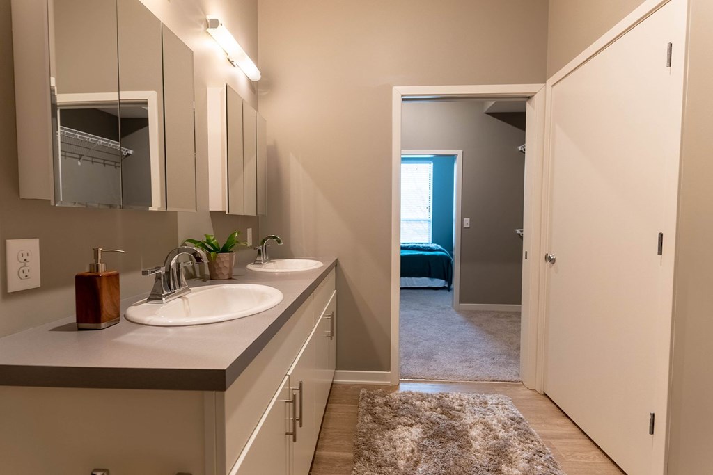 Studio, one, and two-bedroom apartment featuring stainless steel appliances, artistic industrial design, custom butcher block island, in-unit washer and dryer, and more at Benson Lights Apartments in Benson, NE
