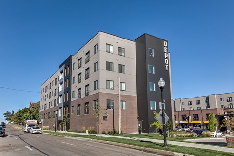 A modern apartment building with the name "Bedrock" on the side.