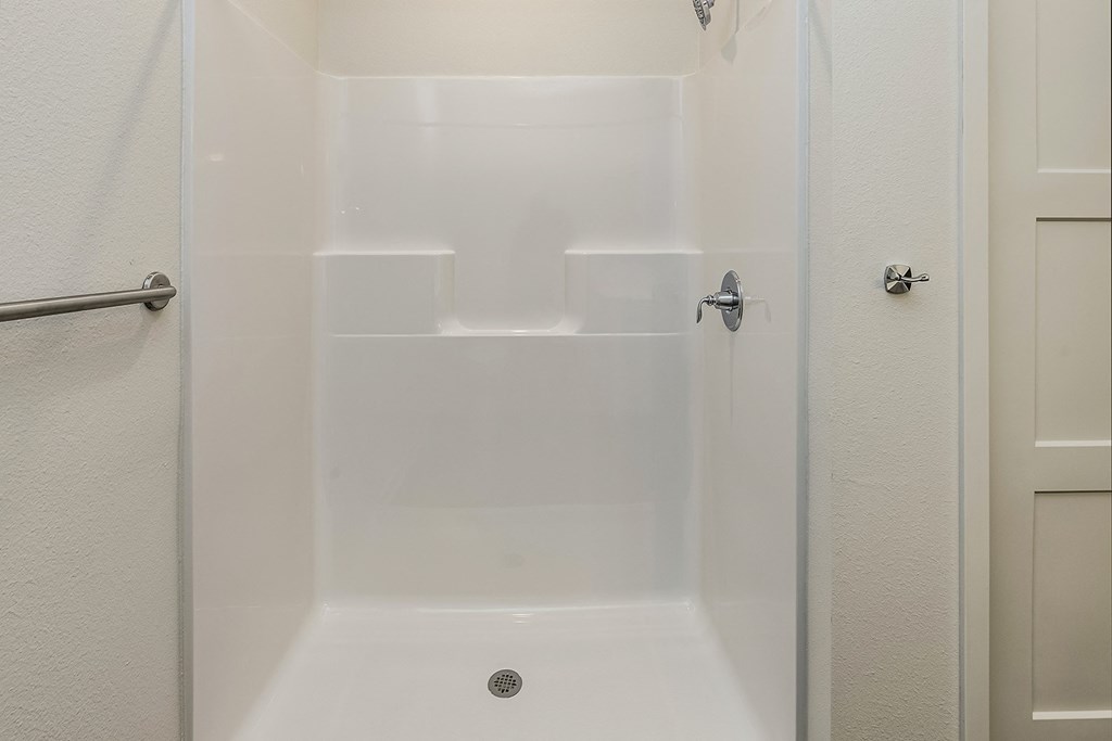 New building with white and dark color schemes with one, two and three bedroom apartment homes at CopperCreek Apartments in Council Bluffs, IA