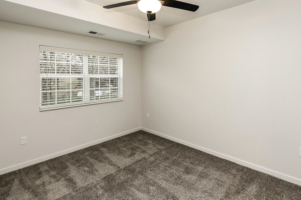 New building with white and dark color schemes with one, two and three bedroom apartment homes at CopperCreek Apartments in Council Bluffs, IA