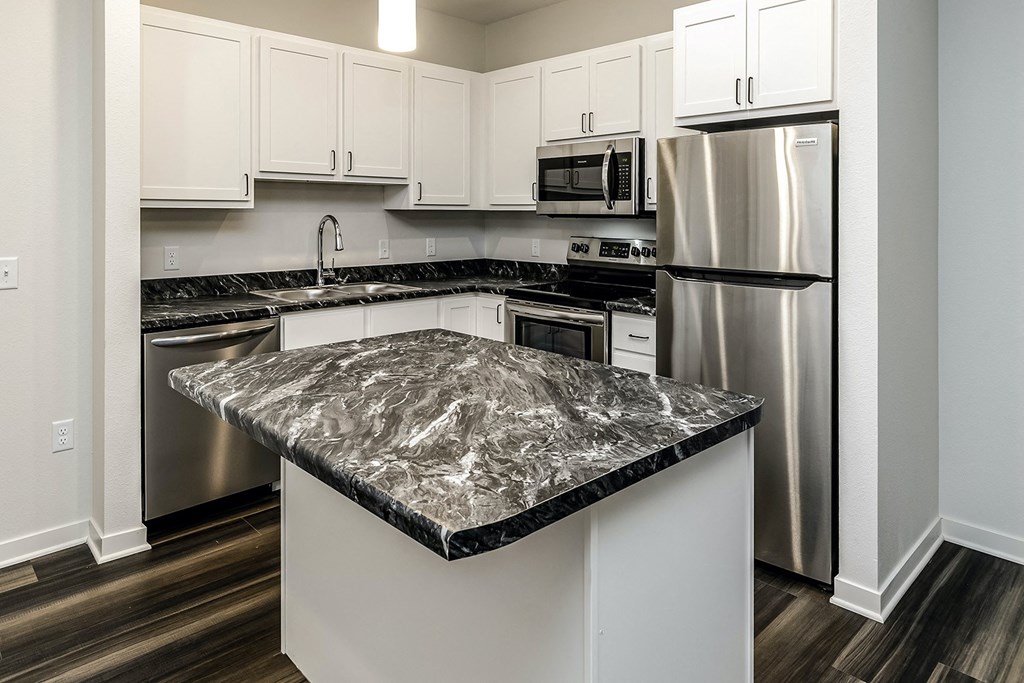 New building with white and dark color schemes with one, two and three bedroom apartment homes at CopperCreek Apartments in Council Bluffs, IA