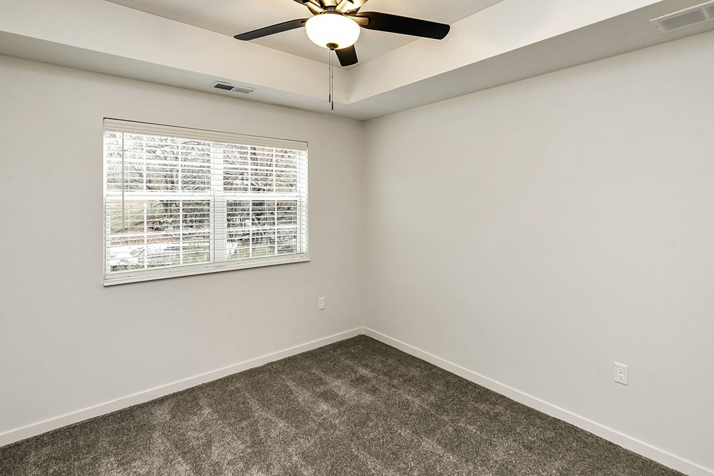 New building with white and dark color schemes with one, two and three bedroom apartment homes at CopperCreek Apartments in Council Bluffs, IA
