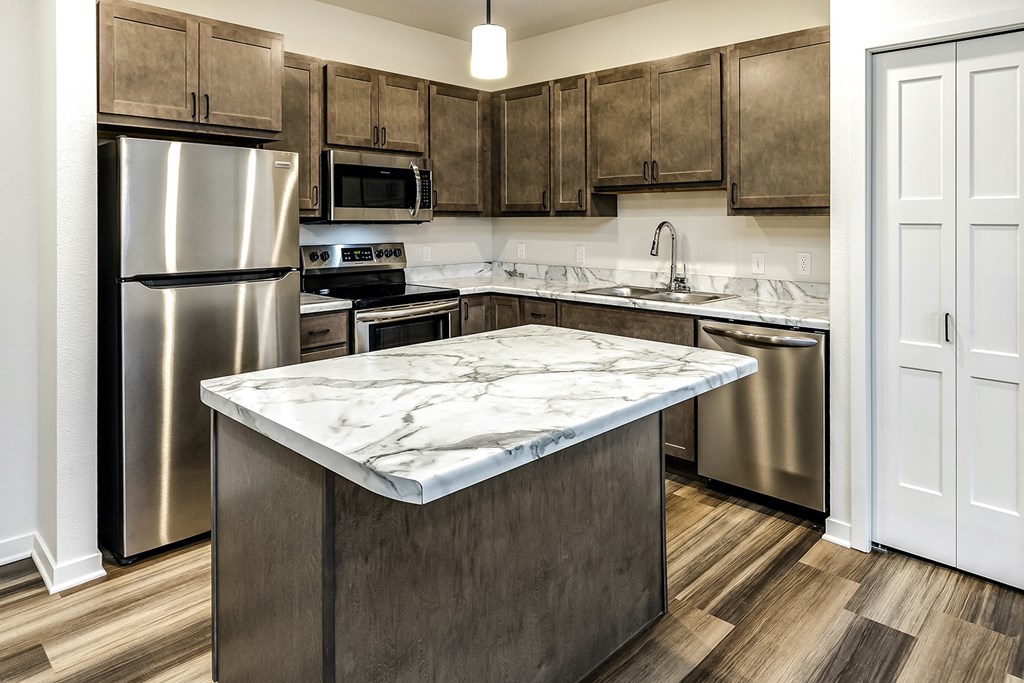 New building with white and dark color schemes with one, two and three bedroom apartment homes at CopperCreek Apartments in Council Bluffs, IA