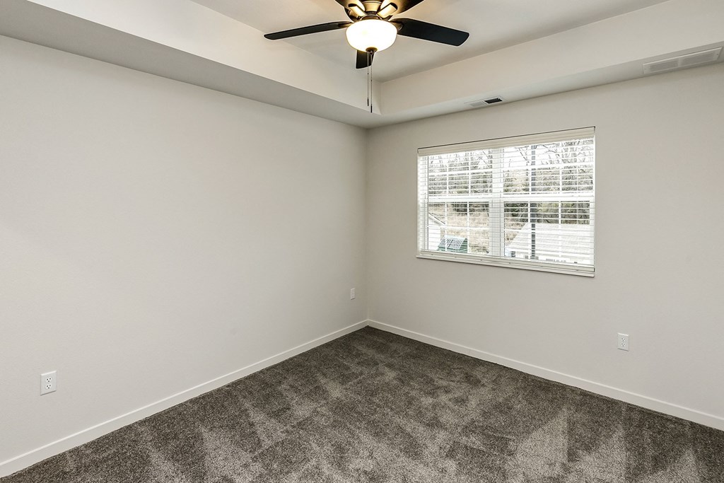 New building with white and dark color schemes with one, two and three bedroom apartment homes at CopperCreek Apartments in Council Bluffs, IA