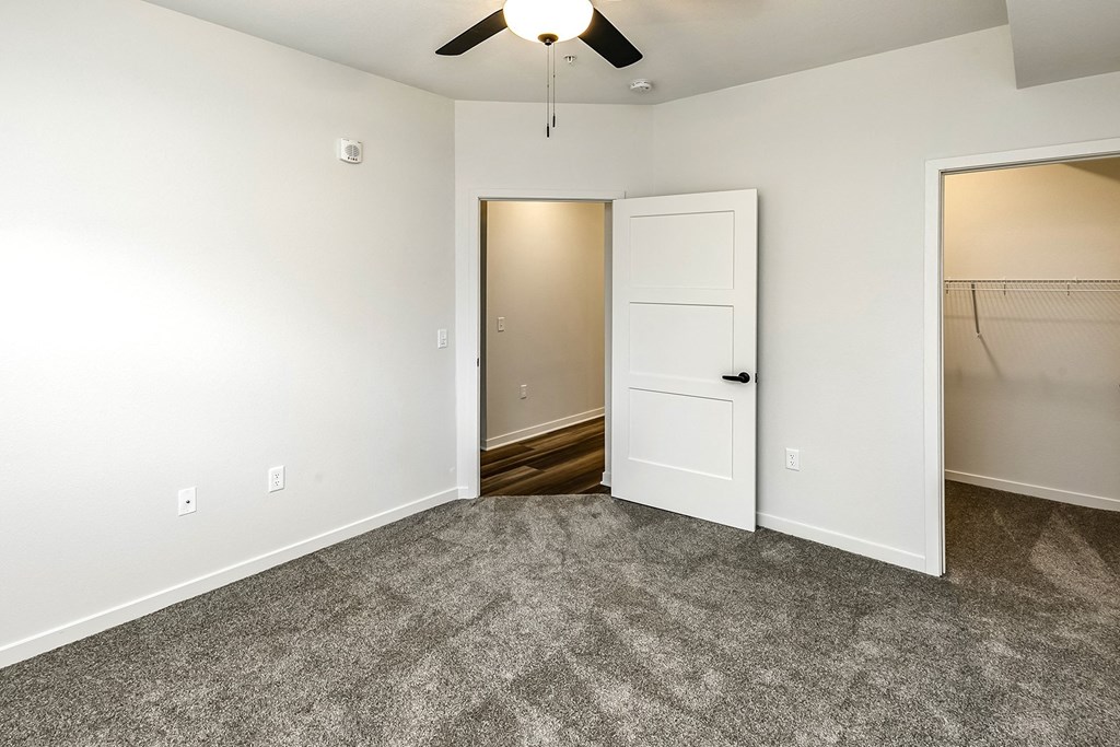 New building with white and dark color schemes with one, two and three bedroom apartment homes at CopperCreek Apartments in Council Bluffs, IA
