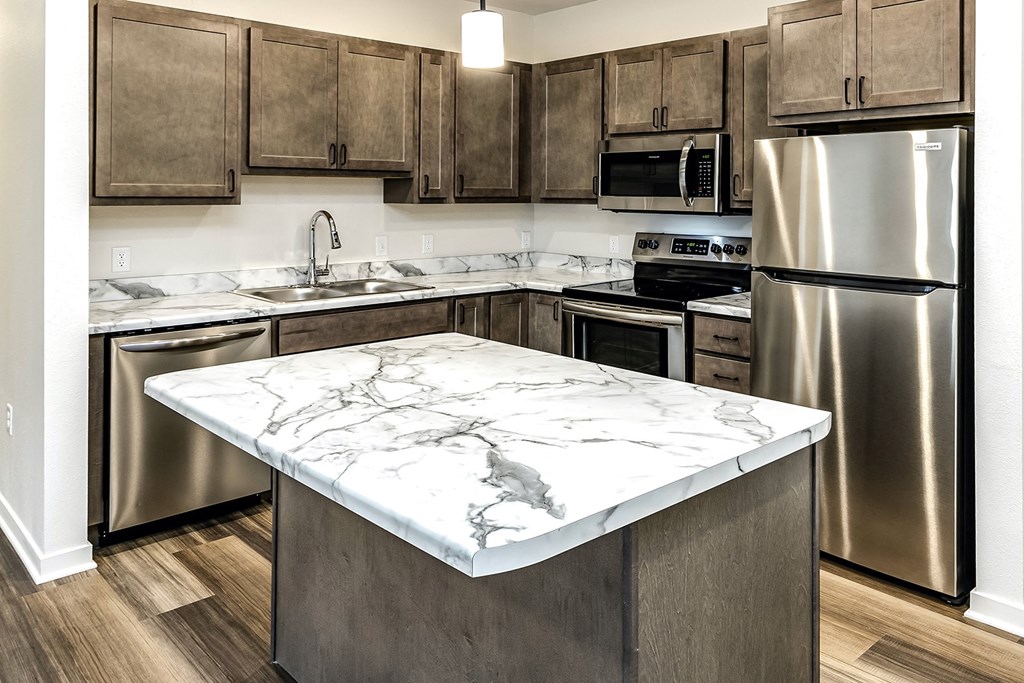 New building with white and dark color schemes with one, two and three bedroom apartment homes at CopperCreek Apartments in Council Bluffs, IA
