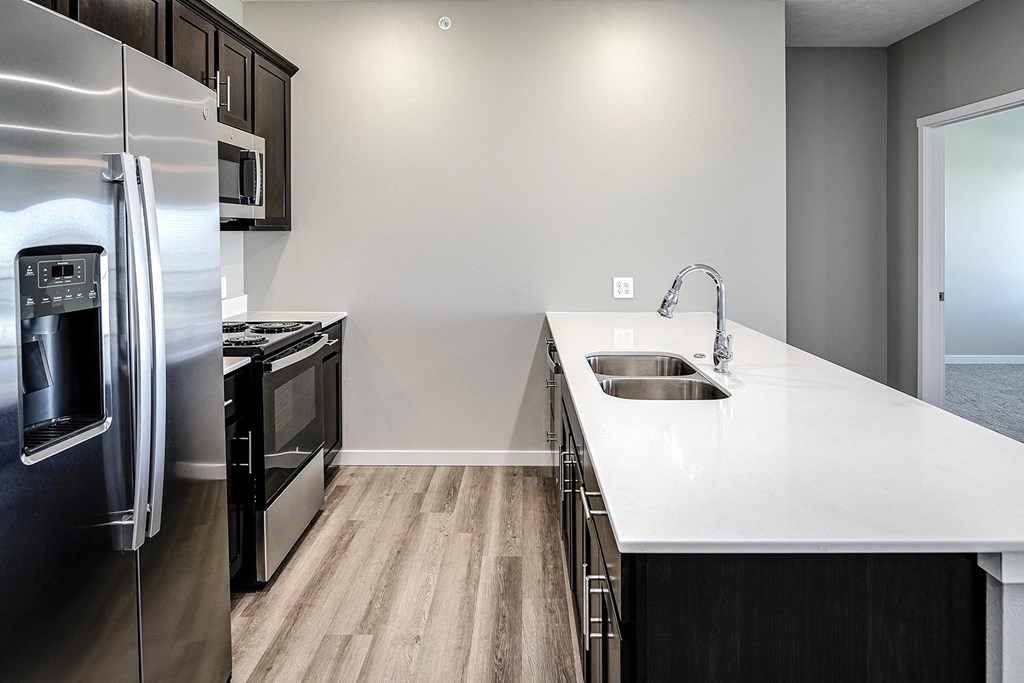 Kitchen with stainless steel appliances at Cross Creek in Lexington, NE