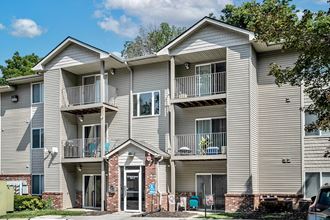Exterior with balconies at Deer Park Apartments in Council Bluffs, IA